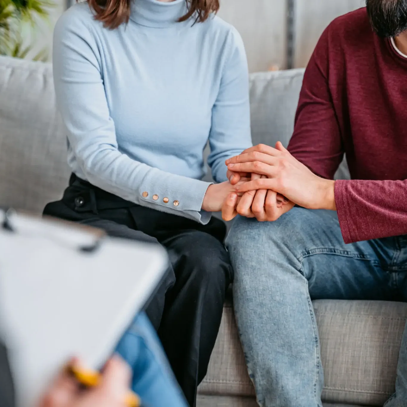 A therapist comforting a patient during a counseling session.